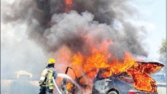Car blaze ignites small brushfires