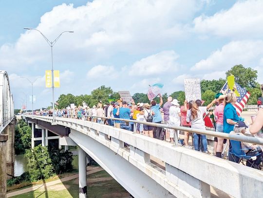 ACTIVISTS FLOOD BASTROP BRIDGE
