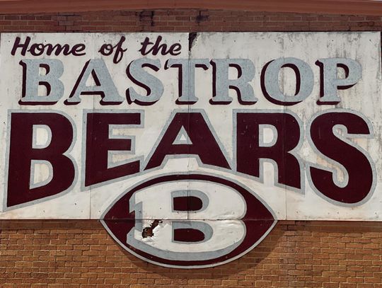 Behind the old signs, new educational courses will give Bastrop ISD students the knowledge they need to succeed in STEM fields. Photo by Niko Demetriou