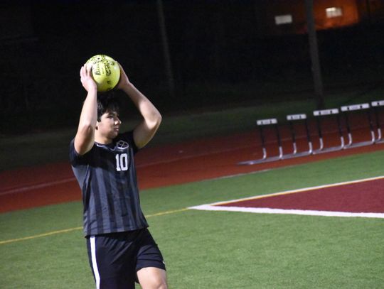 Bastrop’s leading scorer James Ramon prepares to deliver a throw-in pass. Photo by Quinn Donoghue