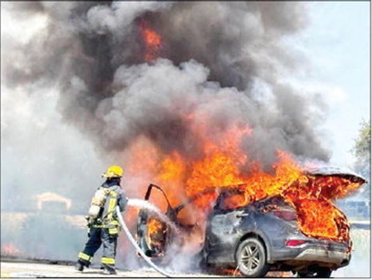 Car blaze ignites small brushfires
