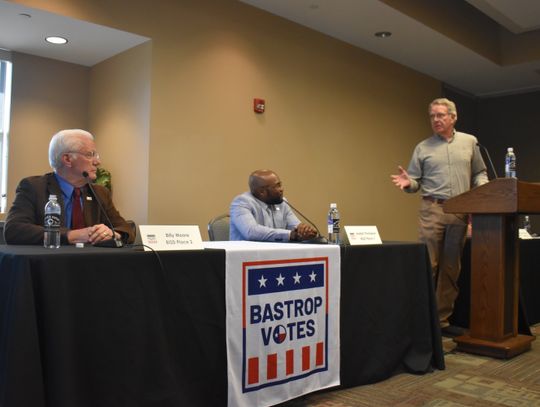 Moderator Charlie Stone (right) explains rules of the Bastrop ISD candidate forum held at the Bastrop Chamber of Commerce in Bastrop April 11 to Billy Moore (left) and Joseph B. Thompson. Photo by Fernando Castro