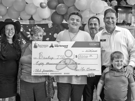 Dealership presents $80,000 check to Bastrop ISD, supports TBI awareness