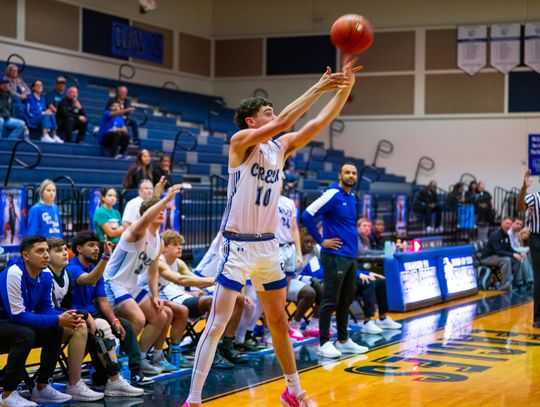 Cedar Creek High School boys varsity basketball junior Phineas Koplin shoots a three-pointer Nov. 30 during the Eagles’ home tournament game against Round Rock Westwood High School. Photo courtesy of Bastrop ISD