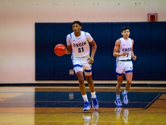 Cedar Creek High School boys varsity basketball junior Kenji Franklin (21) and senior Robert Conrad (1) in action Nov. 30, 2023, during the Eagles’ home tournament game versus Round Rock Westwood High School. Photo courtesy of Bastrop ISD