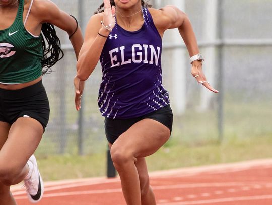 Kaylin Cook picks up a silver medal for her team in the 4x100-meter relay. Photo by Erin Anderson