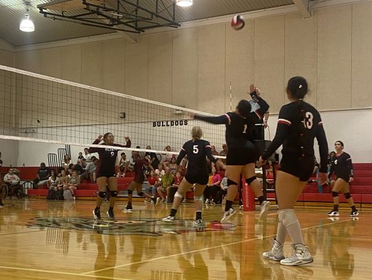 McDade High School varsity volleyball senior Steffanie Zavala (1) goes up high to spike the ball on Aug. 29 during the Lady Bulldogs’ home match victory against Hearne High School. Photo courtesy of Aaron Hallford