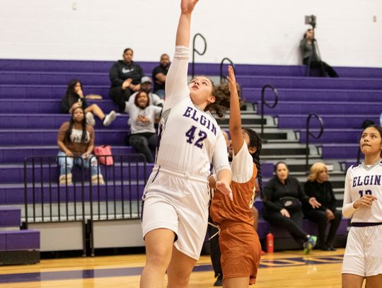 Alexia Perez converts a layup off a beautiful assist from one of her teammates. Photo by Erin Anderson