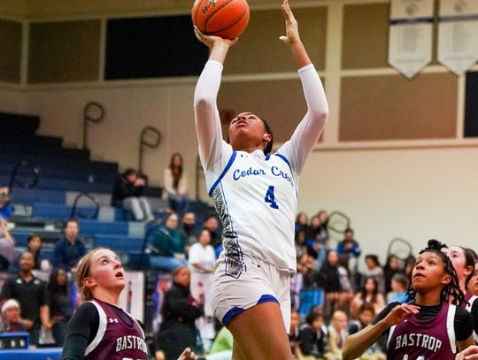 Cedar Creek High School girls varsity basketball sophomore Keiyara Limuel Washington (4) attacks the basket and scores Dec. 5 during the Lady Eagles’ district home game against Bastrop High School. Photo courtesy of Bastrop ISD