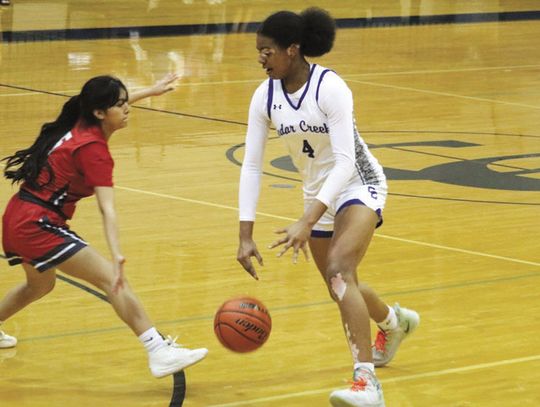 Cedar Creek High School girls varsity basketball sophomore Keyaira Limuel Washington drives to the basket Nov. 14 during the Lady Eagles’ dominant 70-20 victory at home over Austin Travis Early College High School. Photo by Hopie Almendarez Sosa