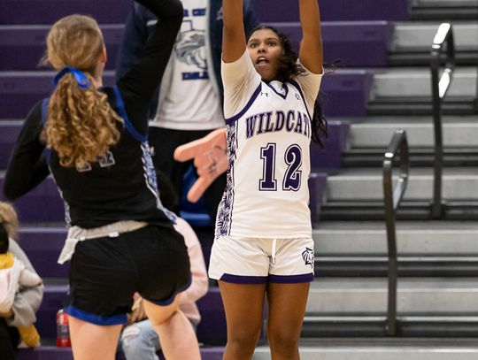 Elgin High School girls varsity basketball sophomore Trinity Martinez shoots a three-pointer Jan. 9 during the Lady Wildcats’ 47-17 district home victory over Cedar Creek High School. Photo by Erin Anderson