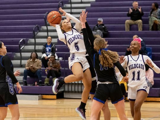 Elgin High School girls varsity basketball senior Keera Williams (5) puts up a shot over a defender Jan. 9 during the Lady Wildcats’ lopsided 47-17 victory at home versus Cedar Creek High School. Photo by Erin Anderson