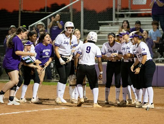 Elgin High School varsity softball celebrates a home run by Jaylan Roberson during the Lady Wildcats’ victory March 24 over Pflugerville High School. Photo by Erin Anderson