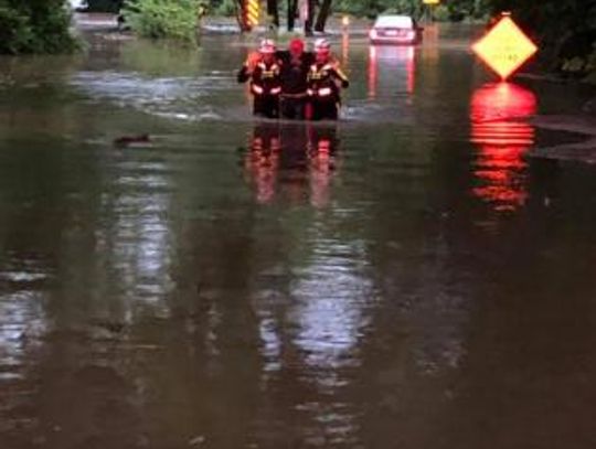 A driver is rescued from a vehicle in high water on the 200 block of Old Sayers Road in Elgin May 7, 2019.   Photo by Henry Hernandez