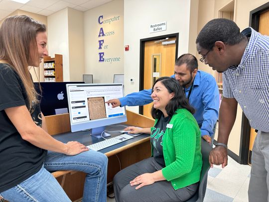 From left, former Elgin Courier general manager Heather Ott, Elgin Public Library director Paula Waak, Elgin Courier reporter Fernando Castro and Granite Media Partners area editor Jason Hennington look at the The Portal to Texas History website at the Elgin Public Library in Elgin April 1...