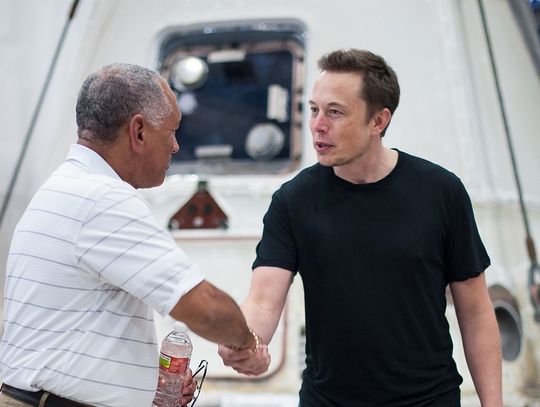 NASA Administrator Charles Bolden, left, congratulates SpaceX CEO and Chief Designer Elon Musk in front of the historic Dragon capsule that returned to Earth on May 31 following the first successful mission by a private company to carry supplies to the International Space Station on June 1...