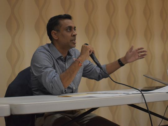 Rajiv Y. Patel, Green Think Consulting managing engineer, sits with Texas Commission on Environmental Quality staff during a meeting in Bastrop March 21. Photo by Fernando Castro