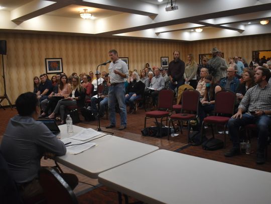 Rajiv Y. Patel, Green Think Consulting managing engineer, sits as he listens to questions from concerned residents at a Texas Commission on Environmental Quality meeting in Bastrop March 21   Photo by Fernando Castro