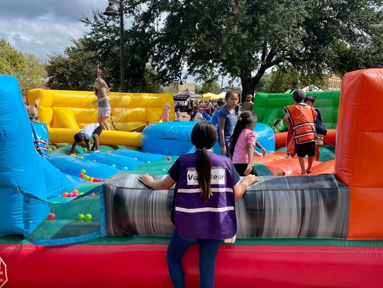 Volunteers had their hands full at the Hogeye festival’s inflatable game stations, a new addition to the celebration. Photo by Niko Demetriou