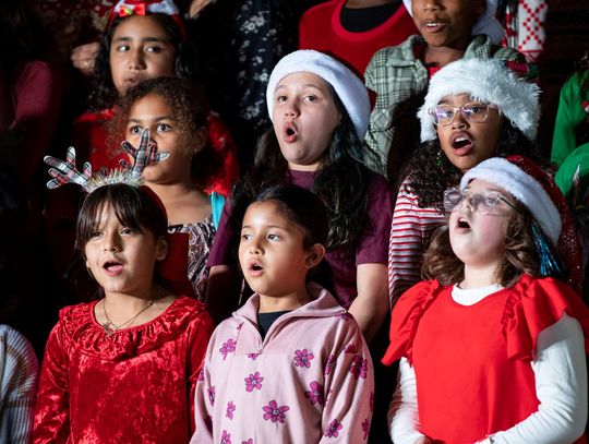 Young performers from the Elgin Holiday Concert at downtown Veterans’ Memorial Park, a combined choir of Neidig, Booker T. Washington and Elgin Elementary School students. Photo courtesy Erin Anderson 