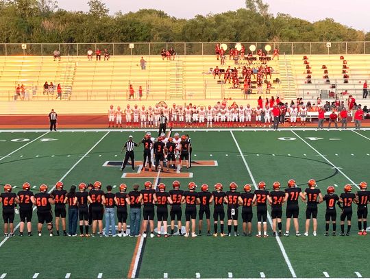 The Smithville High School varsity football team gathers for the coin toss on Aug. 25 prior to the Tigers’ 37-0 victory at home vs. Austin Travis Early College High School. Photo courtesy of Smithville Athletic Booster Club