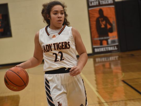 Arabella Gutierrez sets up the offense at the top of the key. Photo by Quinn Donoghue