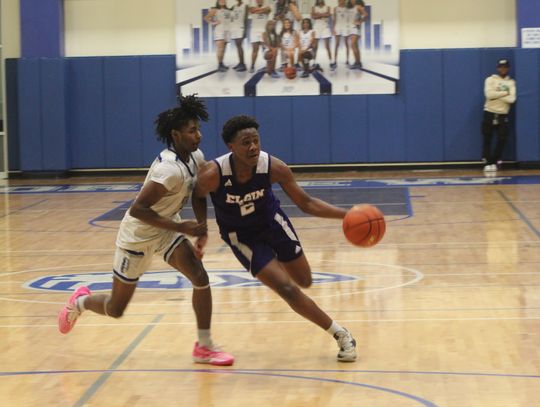 Elgin High School boys varsity basketball junior Amar Bermudez drives to the basket for a score Friday, Dec. 15 during the Wildcats’ 50-44 victory on the road against Manor New Tech High School. Photo by Andrew Salmi