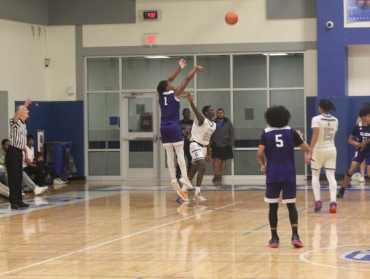 Elgin High School boys varsity basketball senior guard Nathen Lewis (1) knocks down a three-pointer Friday, Dec. 15 during the Wildcats’ 50-44 road victory at Manor New Tech High School. Photo by Andrew Salmi