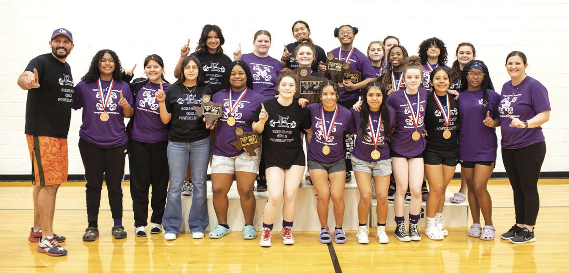 The Elgin High School girls varsity powerlifting team proudly poses together March 4 after winning the THSWPA regional powerlifting meet. Photo by Erin Anderson