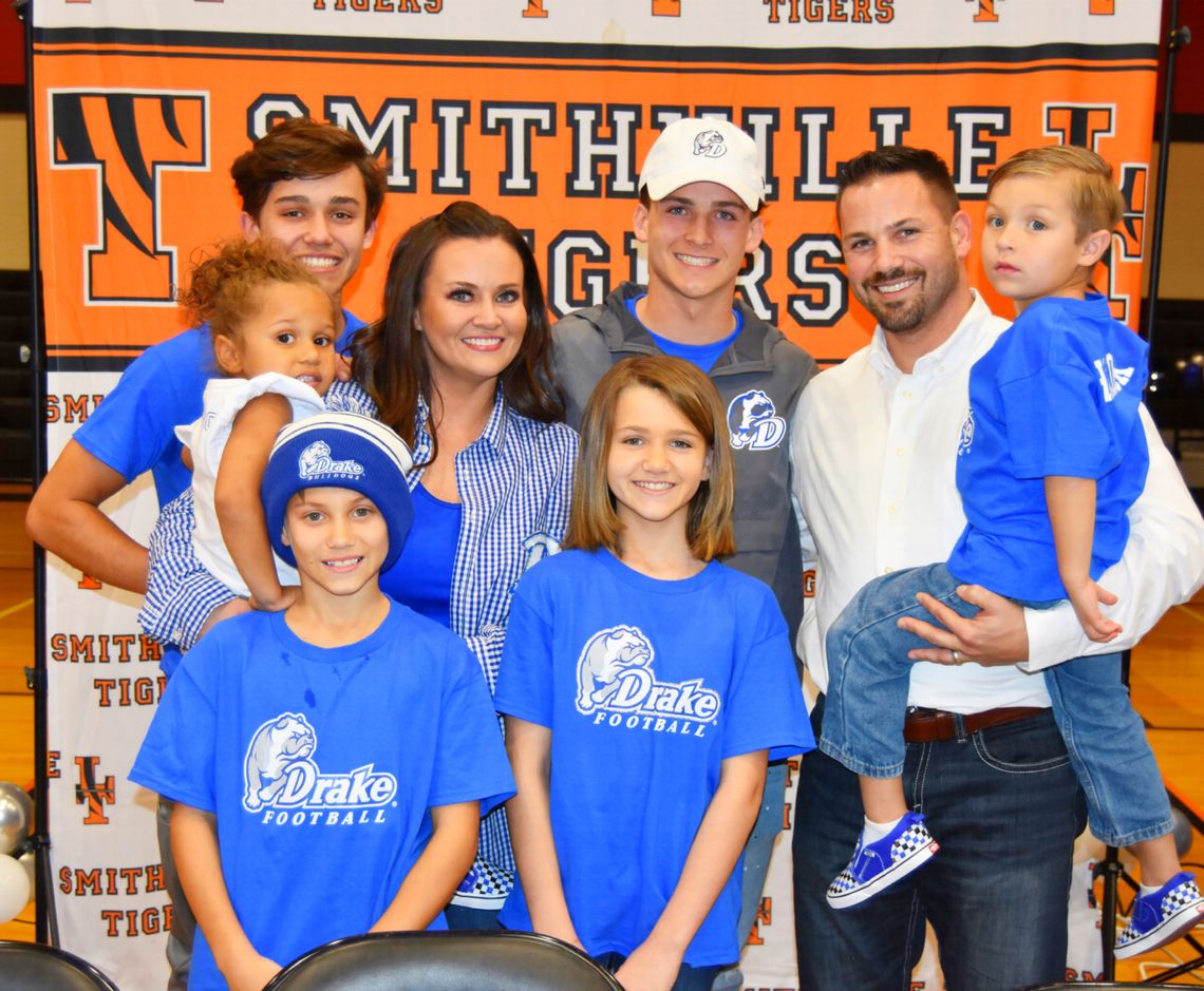 Tyson Hancock (middle) celebrates his official announcement to play for Drake University with family members. Photo courtesy of Lindsey Saunders.