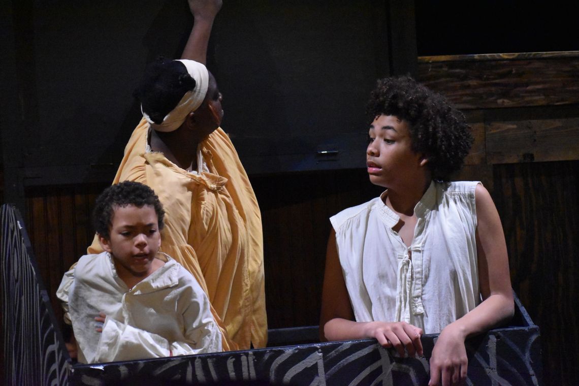 Obie and Amos hide to avoid danger along with Joe – a runaway slave played by Allyah Howard. Photo by Quinn Donoghue