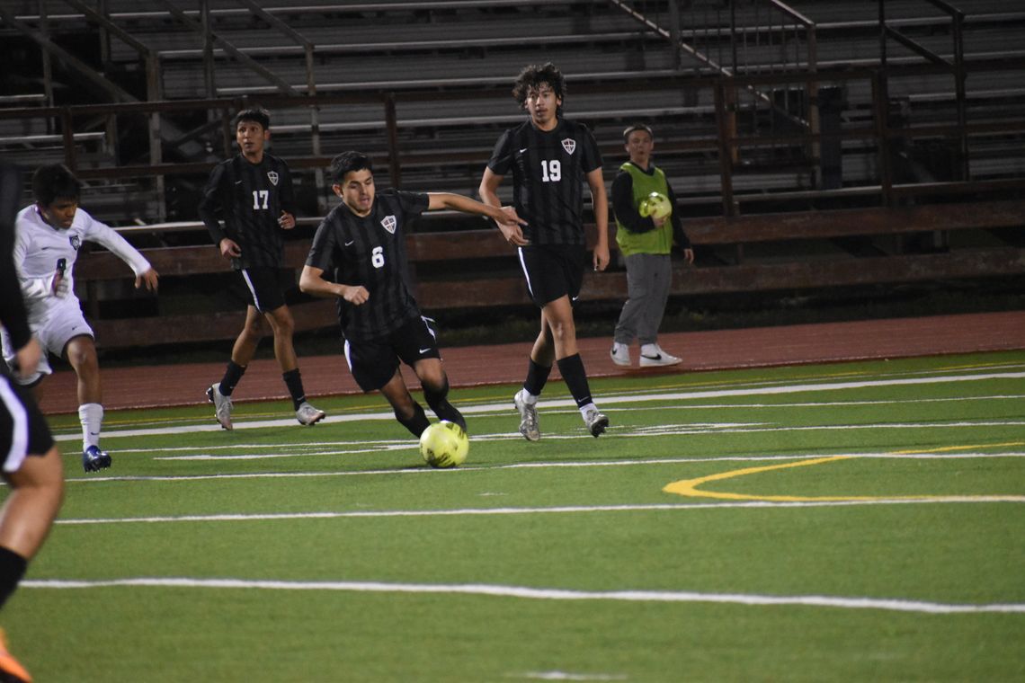 Bryan Ponce, Aaron Arrellano and Salvador Uresti battle Pflugerville Connally in Elgin’s Feb. 16 socer game earlier this season. File photo