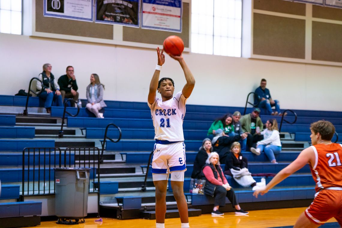 Cedar Creek High School boys varsity basketball junior Kenji Franklin (21) shoots a jumper Thursday, Nov. 30 during the Eagles’ tournament game against Round Rock Westwood High School. Photo courtesy of Bastrop ISD