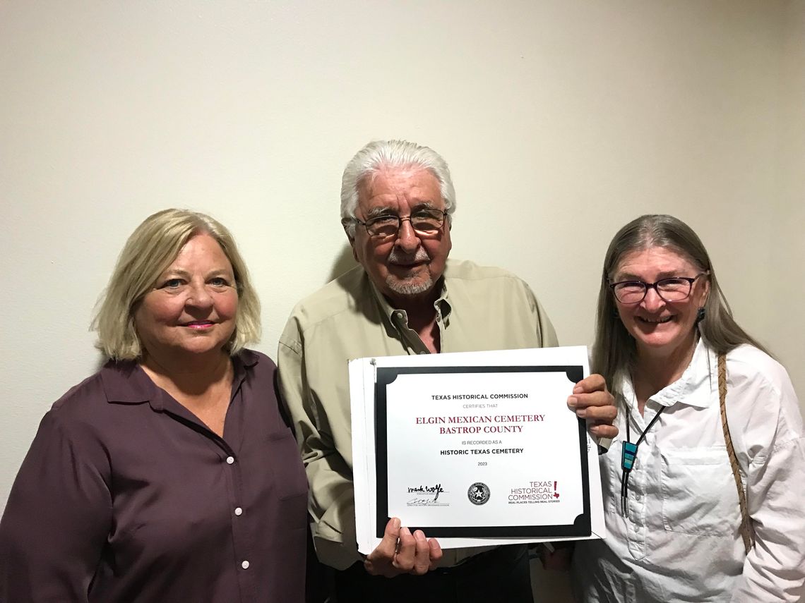 Pictured are members of the community team — Donna Snowden, former Bastrop County Commissioner, Debbie Wahrmund, Bastrop County Historical Commission, and Juan Gonzalez, Elgin Mexican Cemetery Association — holding the certificate in regards to the Elgin Mexican Cemetery’s designation as a...