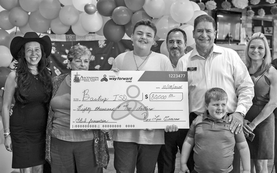 Dealership presents $80,000 check to Bastrop ISD, supports TBI awareness