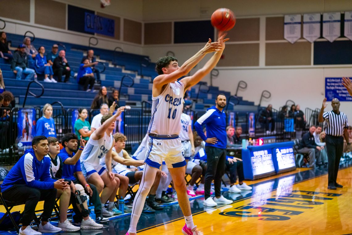 Cedar Creek High School boys varsity basketball junior Phineas Koplin shoots a three-pointer Nov. 30 during the Eagles’ home tournament game against Round Rock Westwood High School. Photo courtesy of Bastrop ISD