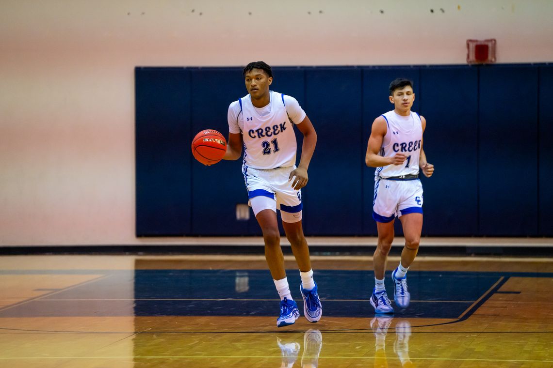 Cedar Creek High School boys varsity basketball junior Kenji Franklin (21) and senior Robert Conrad (1) in action Nov. 30, 2023, during the Eagles’ home tournament game versus Round Rock Westwood High School. Photo courtesy of Bastrop ISD