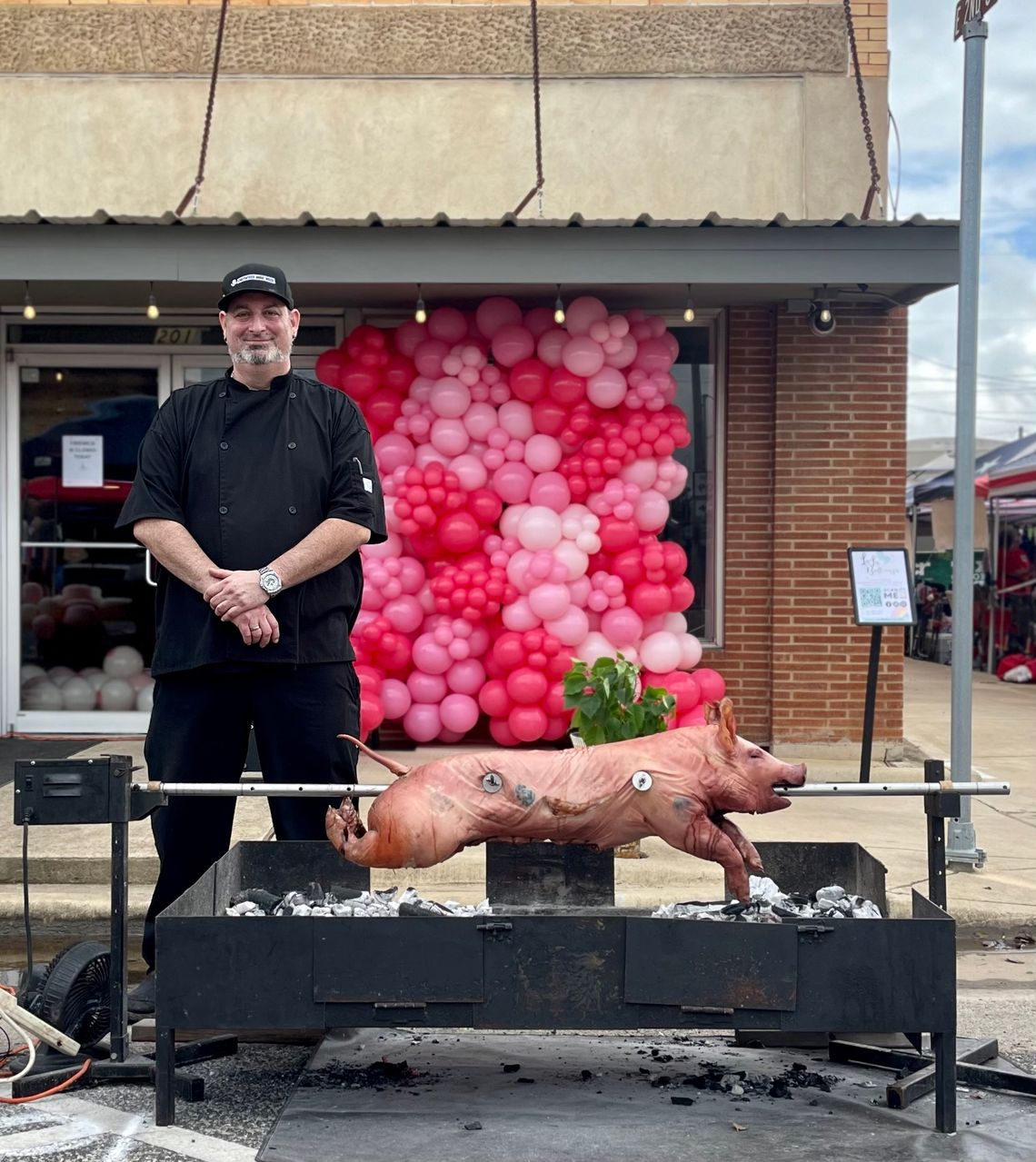 Pat O’Brien with Firewild On Main during this year’s Hogeye Festival, whose roasted pork was donated to a local soup kitchen. Photo by Niko Demetriou