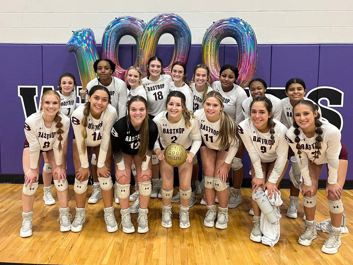 Bastrop High School varsity volleyball senior Fallon Hall and her teammates gather for a photo on Sept. 22 to celebrate 1,000 career assists, which she achieved during the Lady Bears’ match victory at Elgin High School. Photo courtesy of Morgan Rollins