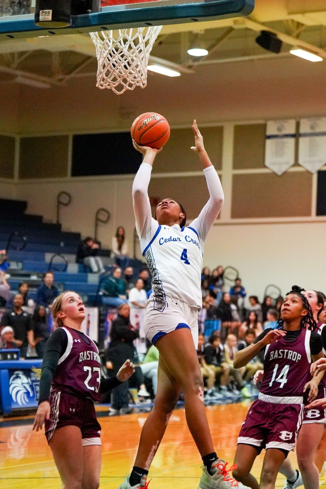 Cedar Creek High School girls varsity basketball sophomore Keiyara Limuel Washington (4) attacks the basket and scores Dec. 5 during the Lady Eagles’ district home game against Bastrop High School. Photo courtesy of Bastrop ISD