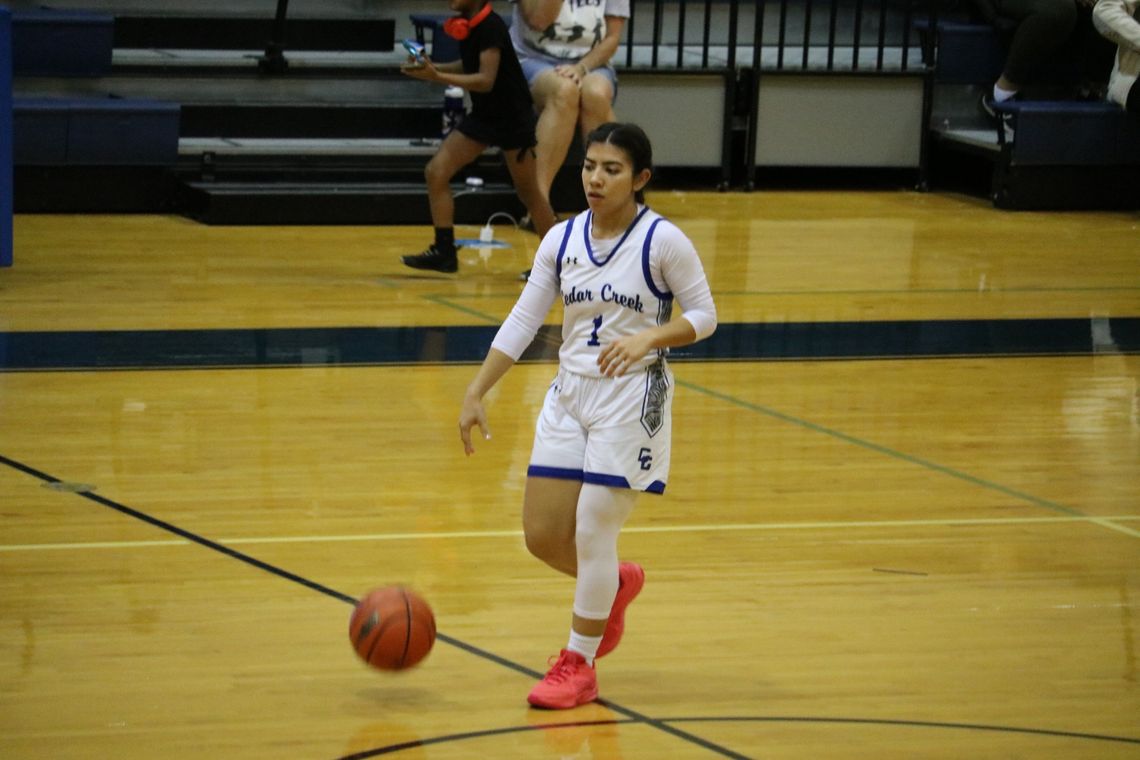 Cedar Creek High School girls varsity basketball junior Elisah Sanchez (1) dribbles the ball upcourt Nov. 14 during the Lady Eagles 70-20 home victory against Austin Travis Early College High School. Photo by Hopie Almendarez Sosa