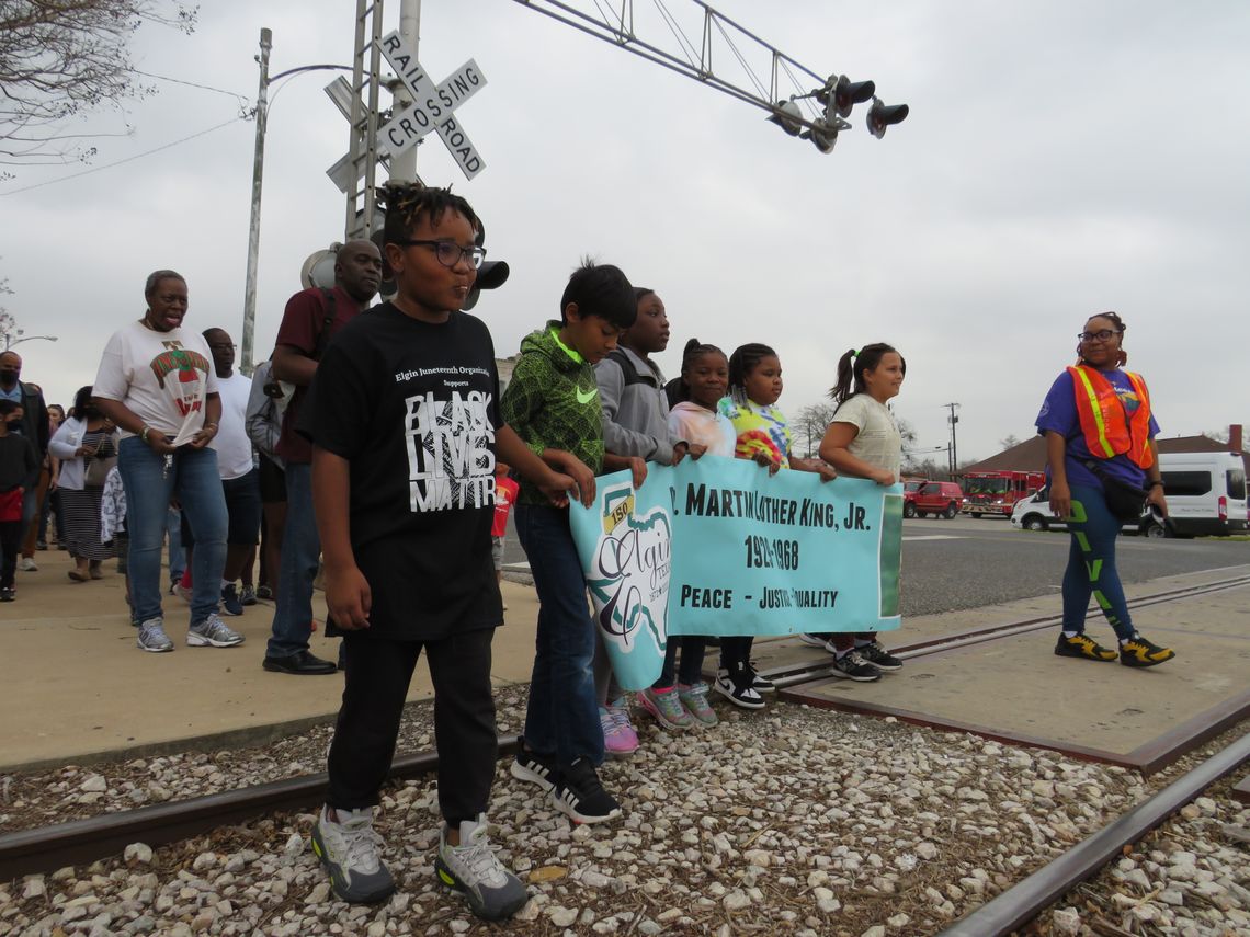 Children lead the 34th Annual Walk for Peace, Justice, and Equality in Elgin Jan. 16. Photo by Fernando Castro