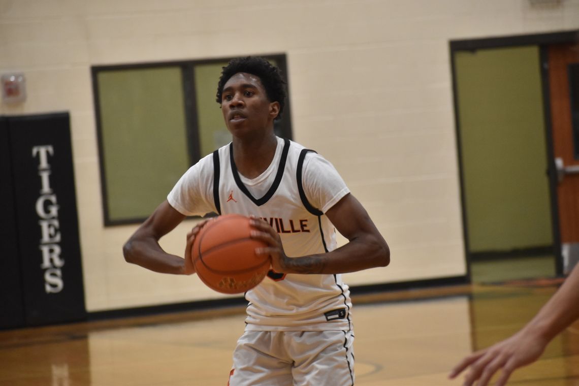 Jacoby Brown makes a strong chest-pass to one of his teammates on the perimeter. Photo by Quinn Donoghue