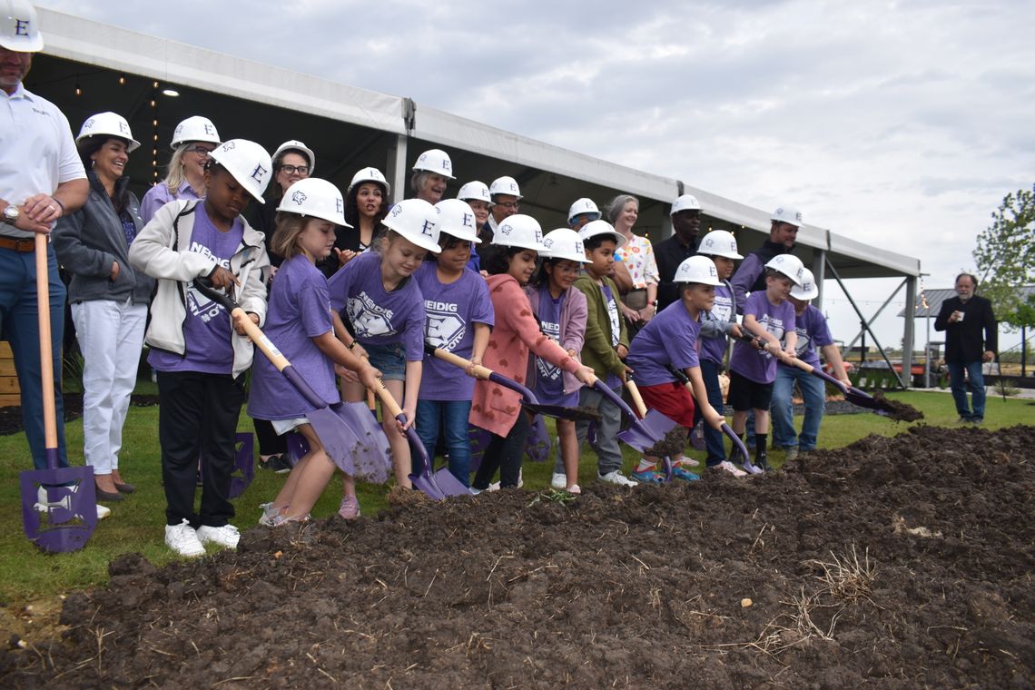 Students along with current and former school staff and school board members help break ground on Harvest Ridge Elementary School in north Elgin April 5. Pictured are, front, Jamarien Jackson, Sonny Ann Rowe, Tristyn Modesette, Mailen Mondragon, Natalie Baena Grimaldo, Presley Perez, Paul...