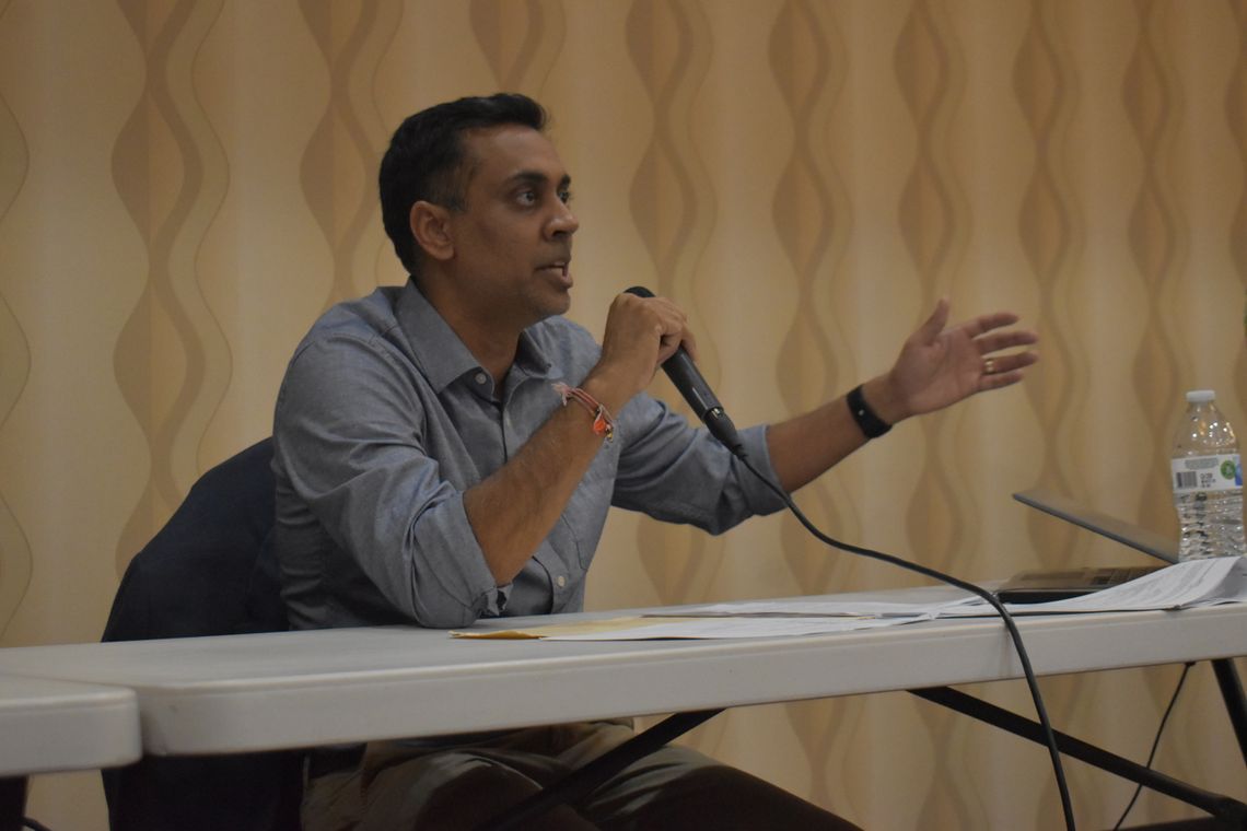 Rajiv Y. Patel, Green Think Consulting managing engineer, sits with Texas Commission on Environmental Quality staff during a meeting in Bastrop March 21. Photo by Fernando Castro