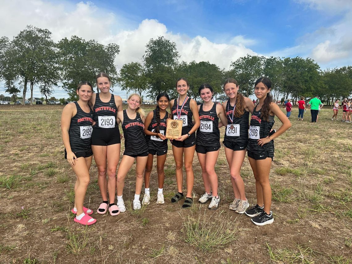 The Smithville High School girls varsity cross country team proudly poses on Thursday, Sept. 21 after the Lady Tigers placed first at the Lake Belton Bronco Invitational meet. Photo courtesy of Smithville Lady Tiger Athletics