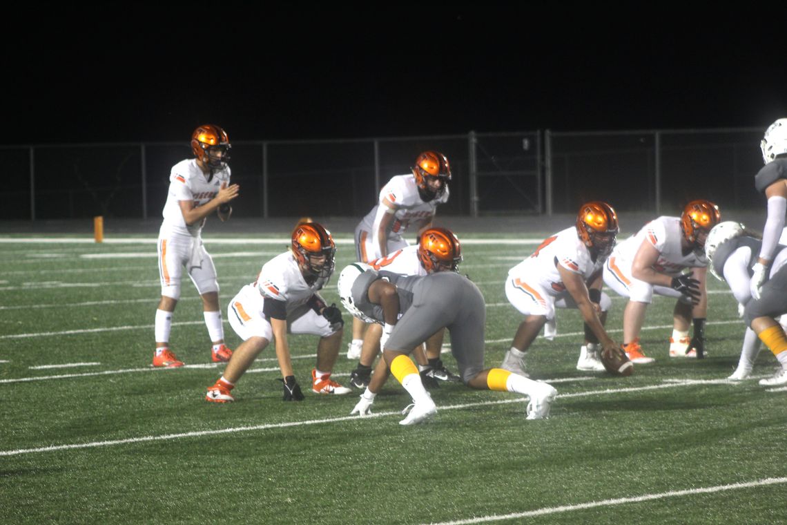 The Smithville High School varsity football team lines up to run an offensive play on Friday, Sept. 15 during the Tigers’ non-district road game against Taylor High School. Photo by Andrew Salmi