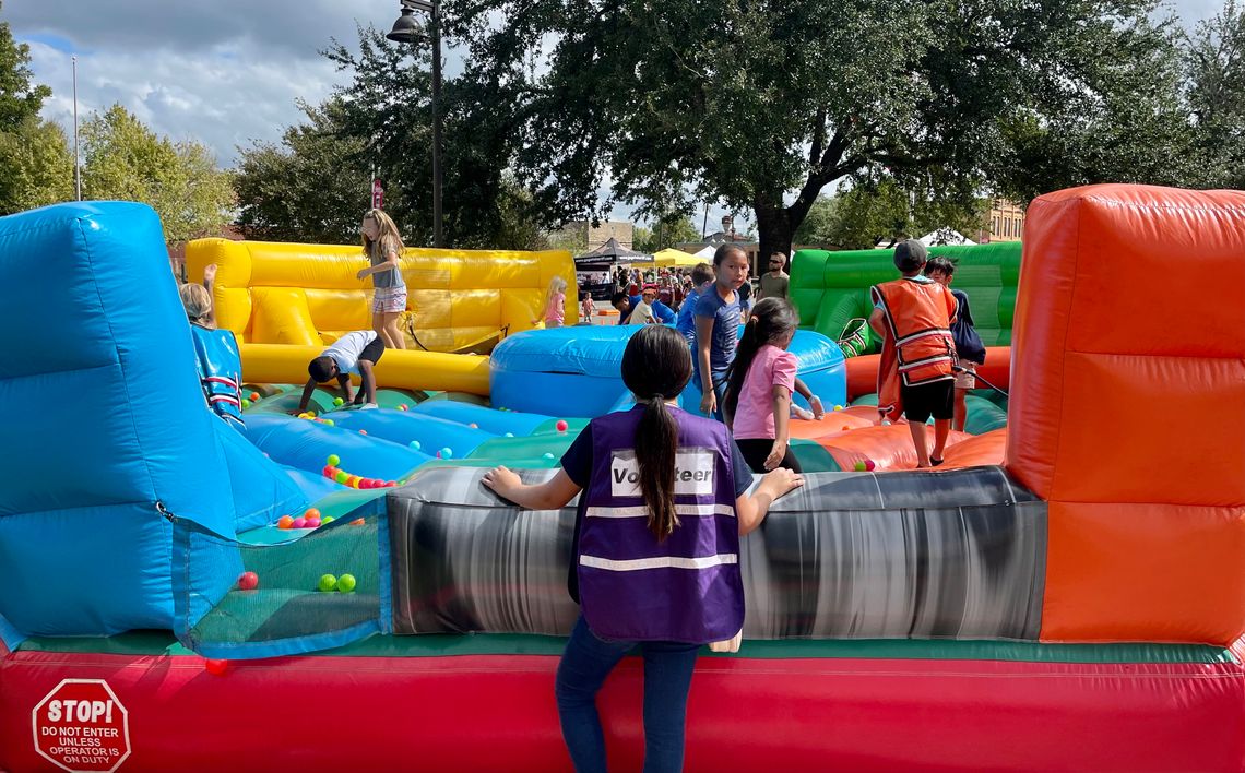 Volunteers had their hands full at the Hogeye festival’s inflatable game stations, a new addition to the celebration. Photo by Niko Demetriou