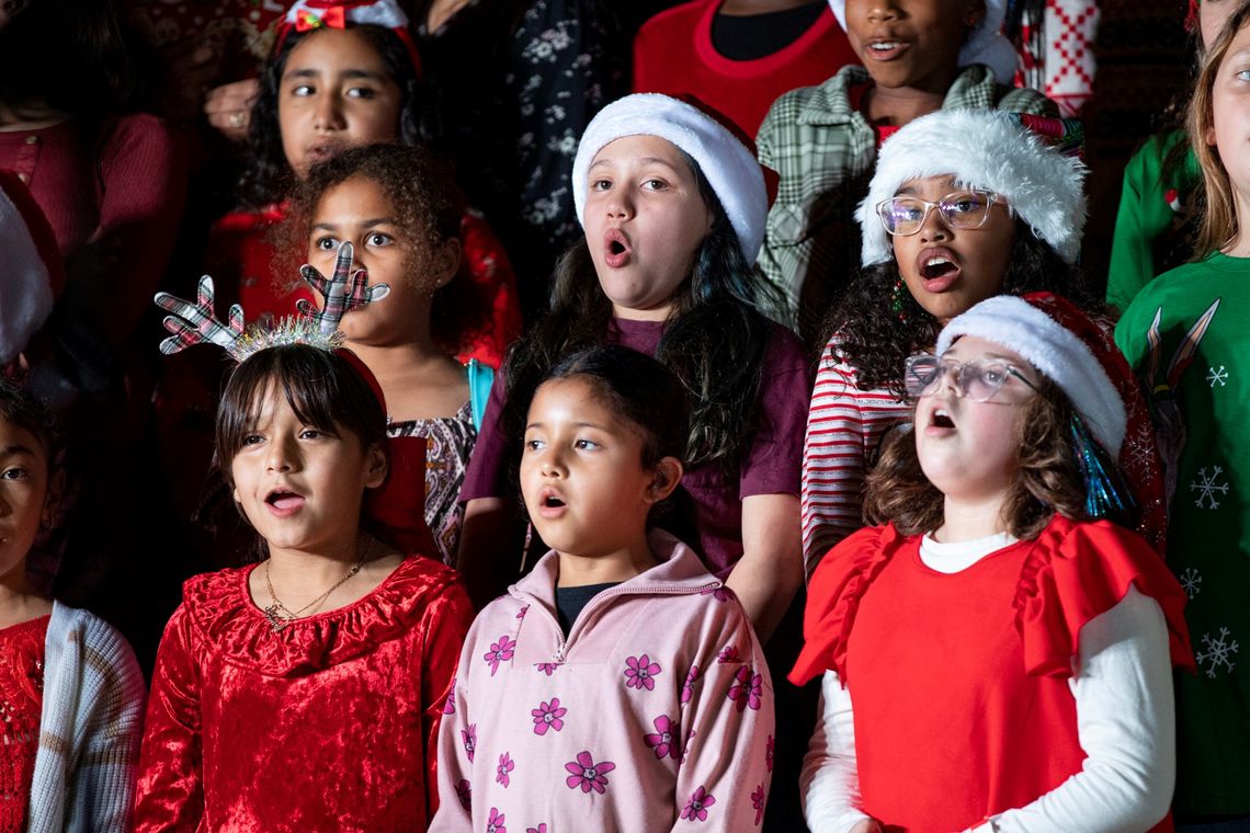 Young performers from the Elgin Holiday Concert at downtown Veterans’ Memorial Park, a combined choir of Neidig, Booker T. Washington and Elgin Elementary School students. Photo courtesy Erin Anderson 