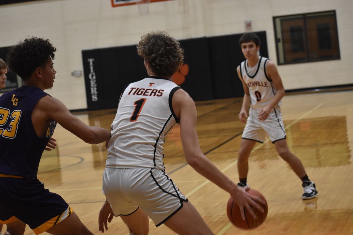 Joseph Mokry backs down a La Grange defender before swinging the ball to one of his teammates. Photo by Quinn Donoghue